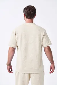 Detailed back view of men's cream summer casual set with textured jacquard pattern