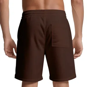Back view of men's brown corduroy athletic shorts showing fabric texture and pocket.