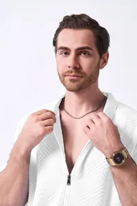 Detailed view of men's white jacquard zipper cardigan jacket showing fabric texture