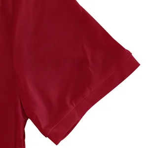 Close-up of short sleeve and breathable pique fabric texture of burgundy Polo shirt