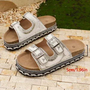 Detailed view of the 5cm/1.96in platform heel on rhinestone double-buckle sandals