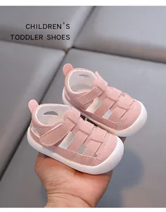 Macro view of pink hollow-out toddler sandals featuring a protective closed toe
