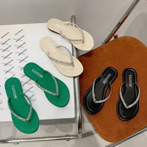 Stylish women's flat flip-flops with sparkling rhinestone straps in multiple colors