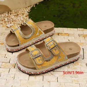 Yellow platform sandals featuring rhinestone buckles and a 5cm cork heel detailed view