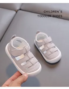Close-up of grey cutout toddler sandals with secure Velcro strap and non-slip soft sole
