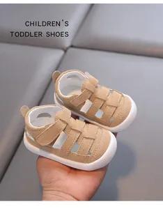 Detailed macro view of beige suede toddler sandals with closed-toe safety and soft soles