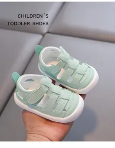 Close-up of mint green toddler sandals featuring hollow design and anti-slip soft soles.