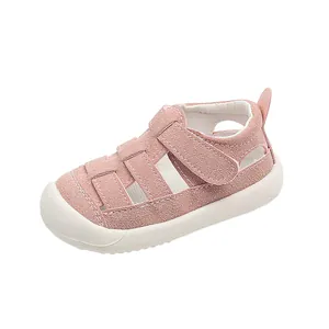 Pink toddler walking sandals with closed-toe protection and breathable hollowed-out design