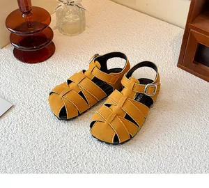 Yellow vintage woven Roman sandals for children with a closed-toe design and buckles.