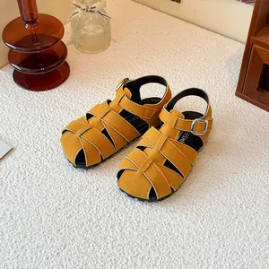 Retro mustard yellow woven Roman sandals for kids featuring a closed-toe summer beach style