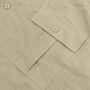 Close-up detail of the breathable linen fabric and pocket on a men's casual summer shirt