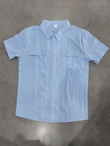 Detailed view of light blue linen shirt featuring two chest pockets and lapel collar