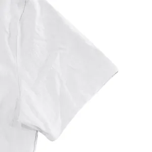Close-up of white linen shirt sleeve showing natural fabric texture and stitching