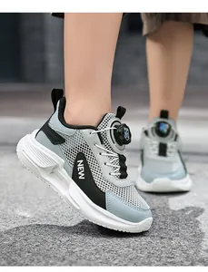 Close-up detail of boys' breathable mesh running shoes with a modern rotary dial lace system
