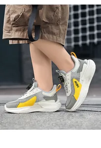 Professional boys' breathable mesh running shoes with rotary buckle in grey and yellow