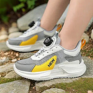 Boys breathable mesh running shoes with rotary lace system and yellow accents