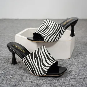 Elegant zebra print high heel mule sandals with stylish black square toe detail