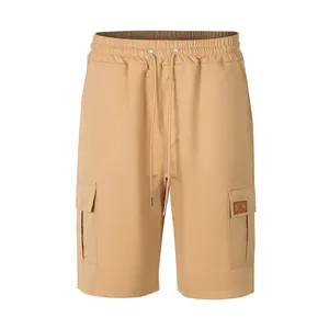 Men's khaki cargo shorts featuring a drawstring waist and flap side pockets.