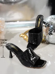 Detail of black crocodile texture mule sandals with 7.5cm heel height measurement