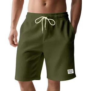 Detail of olive green corduroy athletic shorts for men with drawstring waist