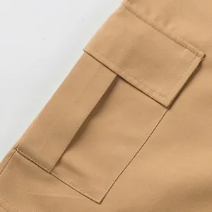 Close-up of durable khaki twill cargo pocket on men's high street style shorts.