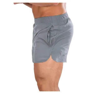 Side profile of breathable grey men's quick-dry 3-inch athletic gym shorts on model