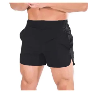 Men's black quick-dry athletic shorts with side slits shown on a fit model for summer