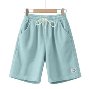 Macro view of corduroy texture and white drawstring on light blue casual shorts