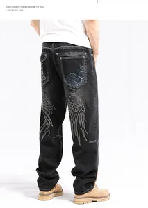 Close-up back view of men's baggy hip-hop denim jeans with detailed wing embroidery
