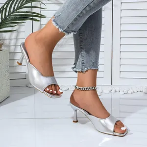 Elegant silver metallic high heel mule sandals with open toe design for stylish women