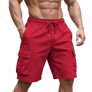 Detail of red men's cargo shorts showing high-street athletic fit on model.