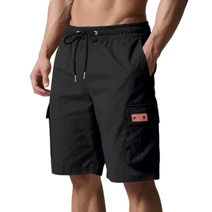 Detail of men's black cargo shorts featuring drawstring waist and functional side pockets.