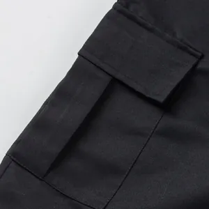 Close-up detail of a functional side cargo pocket on black high-street cotton shorts