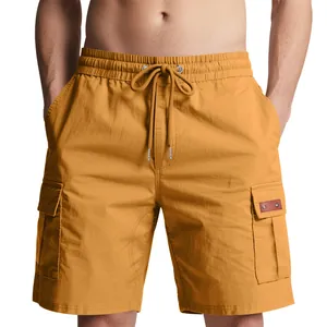 Close-up of men's mustard yellow cargo shorts showing drawstring waist and pockets