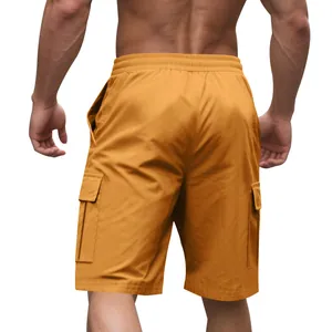 Back view of yellow men's cargo shorts with elastic waist and side pockets