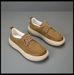 Diagonal perspective of men's brown nubuck casual loafers featuring thick beige soles