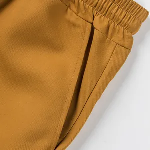 Close-up of durable twill fabric and elastic waistband on men's cargo shorts.