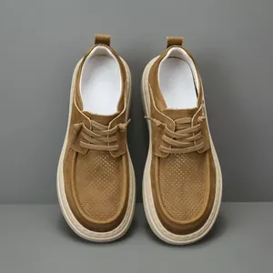 Stylish men's tan leather loafers with perforated design viewed from a top-down studio angle