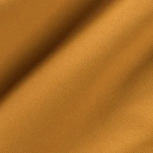 Close-up of mustard yellow diagonal twill fabric for men's casual cargo shorts