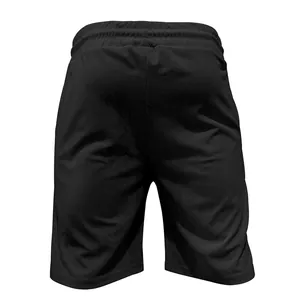 Macro view of the back of black corduroy casual shorts showing textured fabric detail