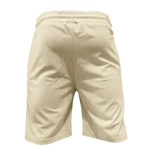 Close-up back view of men's beige corduroy casual shorts with comfortable elastic waistband