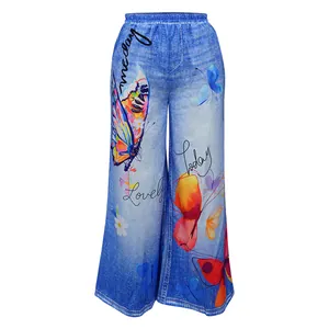 Close-up detail of women's casual wide-leg pants with blue denim print and butterfly pattern