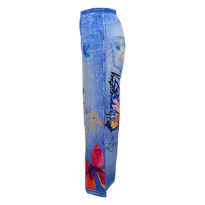 Side view of blue denim-print wide-leg trousers featuring vibrant butterfly patterns