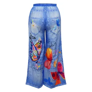 Back view of wide-leg casual pants featuring colorful butterfly and floral prints on blue