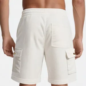 Detailed back view of men's heavy white corduroy cargo shorts showing pocket details