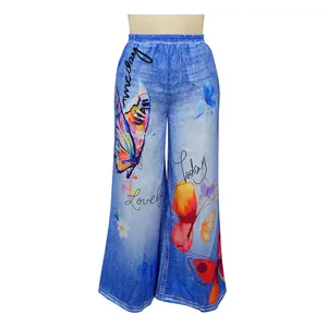 Detailed view of casual wide-leg pants featuring colorful butterfly print and script