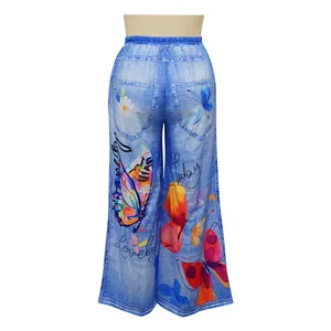Back view of butterfly and floral print wide-leg pants with faux denim texture