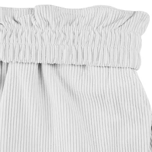 Macro view of white corduroy fabric and elastic waistband detail on men's shorts