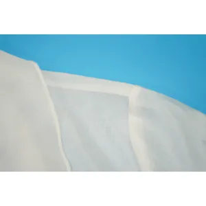Detail showing the lightweight white chiffon fabric and fine shoulder seam stitching