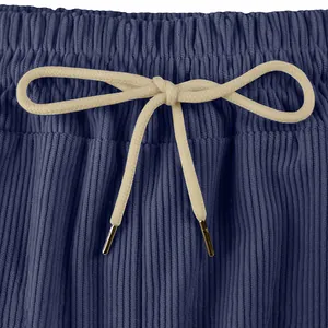 Detailed close-up of adjustable drawstring waistband on men's blue corduroy cargo shorts.